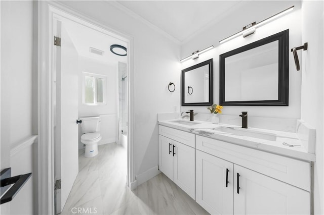 10321 Mcbroom St, Sunland, CA 91040 - bathroom featuring ornamental molding, marble finish floor, toilet, and a sink