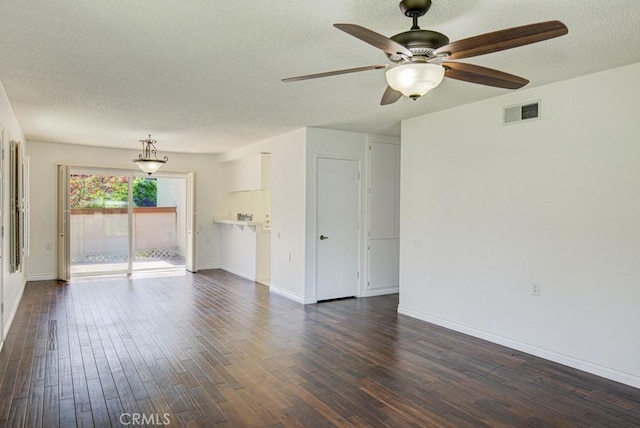 unfurnished living room with baseboards, a ceiling fan, a textured ceiling, and dark wood-style floors