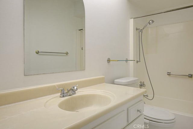 full bath with toilet, vanity, and bathing tub / shower combination