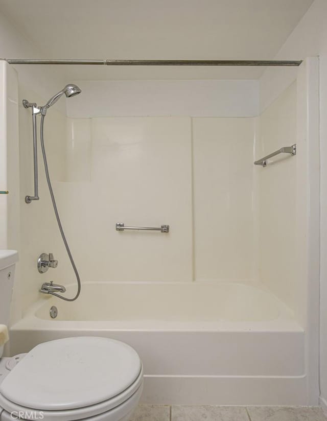 full bath with tile patterned flooring, tub / shower combination, and toilet