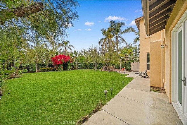 view of yard featuring a fenced backyard and a patio