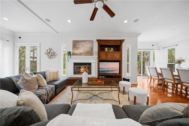 living area with ceiling fan, wood finished floors, and recessed lighting