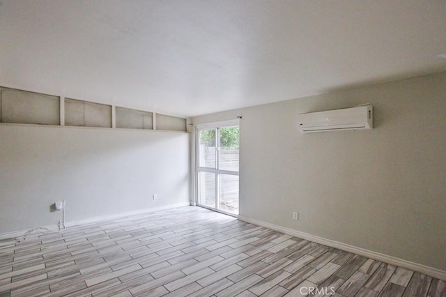 643 W Ramona Dr, Rialto, CA 92376 - unfurnished room with a wall mounted AC and wood finished floors