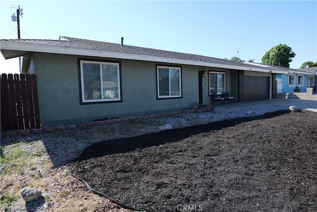 806 S Sandalwood Ave, Bloomington, CA 92316 - rear view of property featuring an attached garage and stucco siding