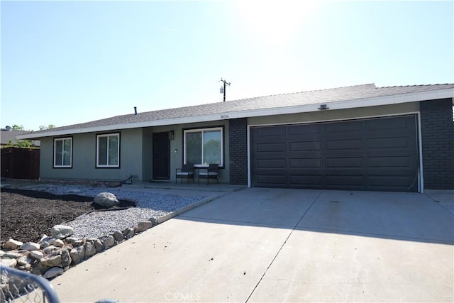 806 S Sandalwood Ave, Bloomington, CA 92316 - ranch-style house with driveway, brick siding, and an attached garage