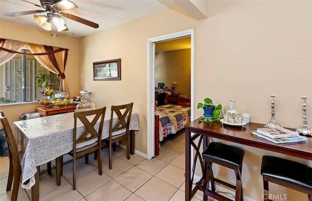 dining room with light tile patterned flooring and ceiling fan