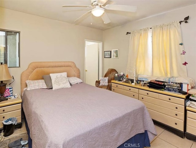 bedroom featuring ceiling fan and light tile patterned floors