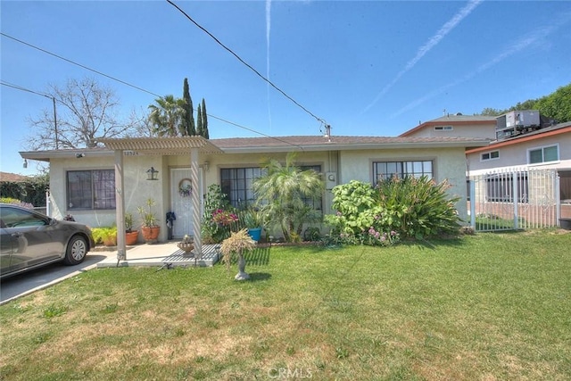 view of front of home featuring stucco siding, a front yard, and central AC unit