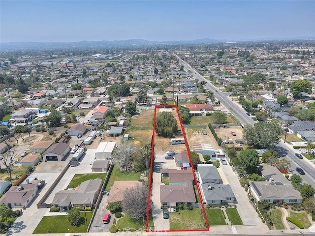 birds eye view of property with a residential view