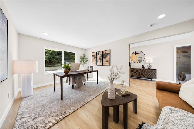 office featuring baseboards, recessed lighting, and light wood-style floors