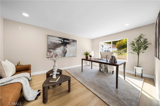home office with recessed lighting, light wood finished floors, and baseboards