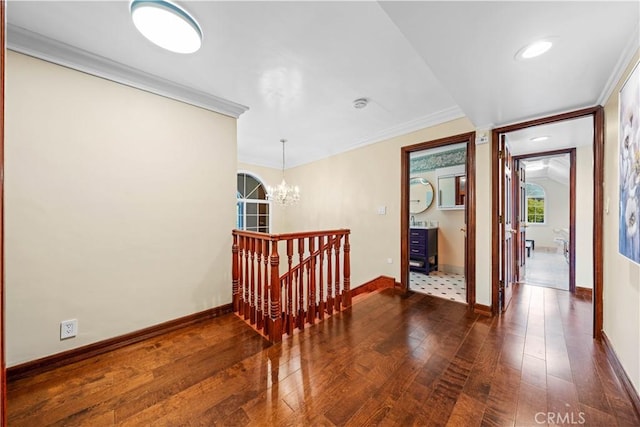 2177 W Silver Tree Rd, Claremont, CA 91711 - hallway featuring a chandelier, hardwood / wood-style flooring, ornamental molding, baseboards, and an upstairs landing