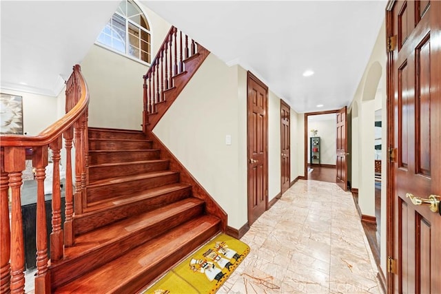 2177 W Silver Tree Rd, Claremont, CA 91711 - stairway featuring baseboards, recessed lighting, arched walkways, and marble finish floors