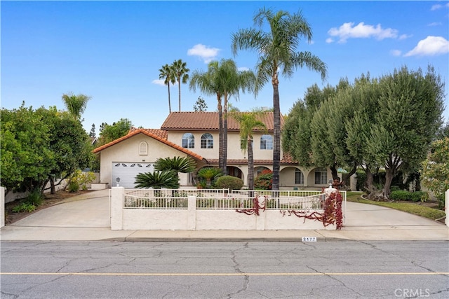 2177 W Silver Tree Rd, Claremont, CA 91711 - mediterranean / spanish-style home with stucco siding, a tiled roof, driveway, and a garage