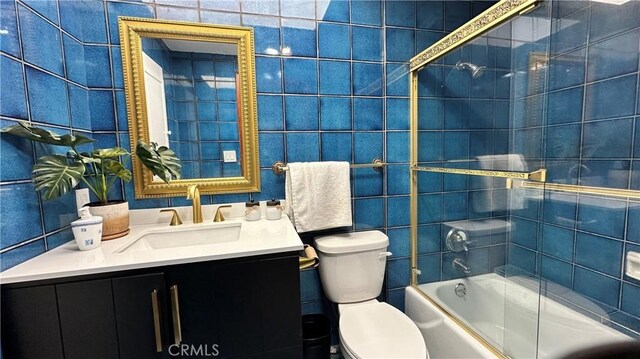 2177 W Silver Tree Rd, Claremont, CA 91711 - bathroom featuring toilet, vanity,  shower combination, and tile walls