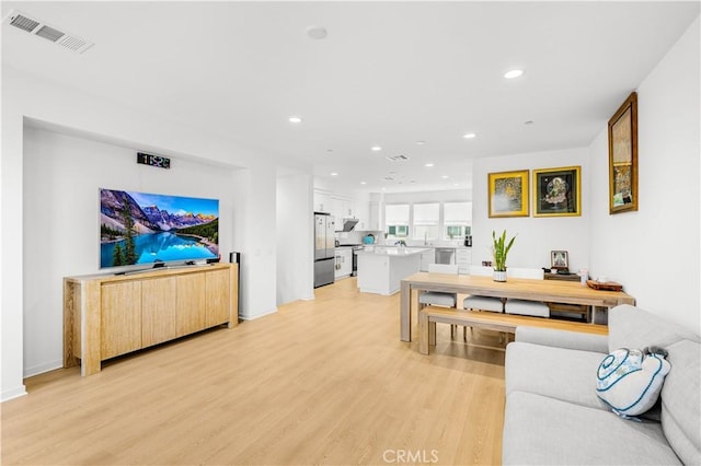 207 Colby Cir, Claremont, CA 91711 - living area with light wood finished floors, recessed lighting, and visible vents