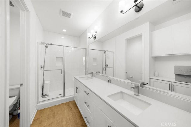 207 Colby Cir, Claremont, CA 91711 - bathroom with toilet, a sink, a shower stall, and visible vents