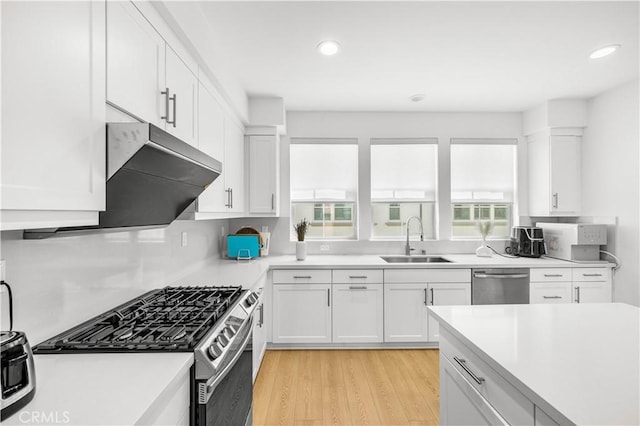 207 Colby Cir, Claremont, CA 91711 - kitchen featuring white cabinetry, a sink, appliances with stainless steel finishes, and light countertops