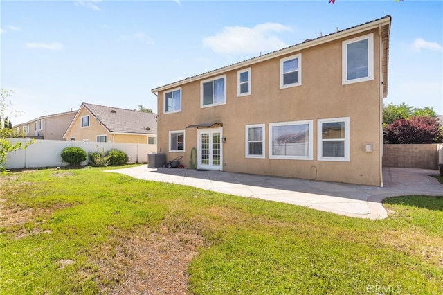 27674 Blue Topaz Dr, Menifee, CA 92585 - back of property featuring stucco siding, central AC unit, a fenced backyard, and french doors
