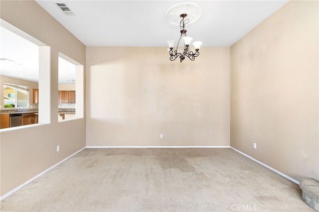 27674 Blue Topaz Dr, Menifee, CA 92585 - empty room featuring baseboards, carpet flooring, a chandelier, and visible vents