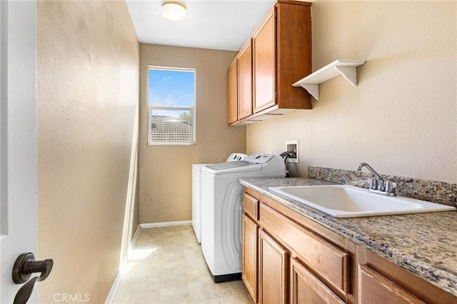 27674 Blue Topaz Dr, Menifee, CA 92585 - washroom featuring baseboards, cabinet space, washer and clothes dryer, and a sink