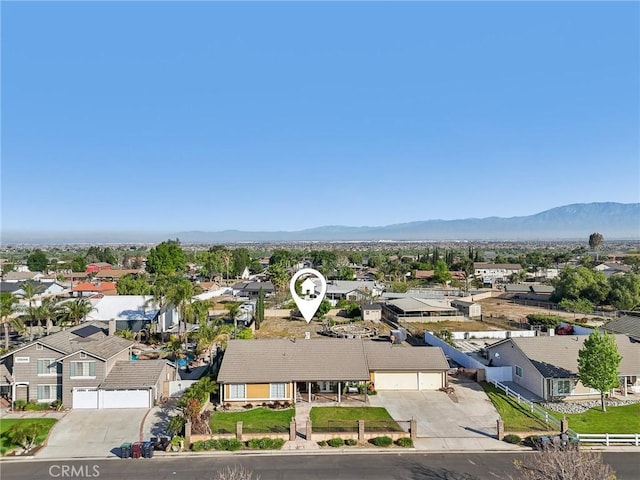 aerial view featuring a mountain view and a residential view
