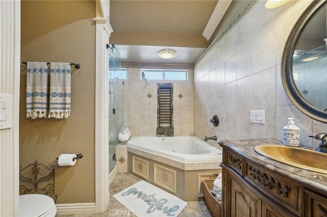 full bathroom featuring a shower stall, toilet, a bath, and vanity