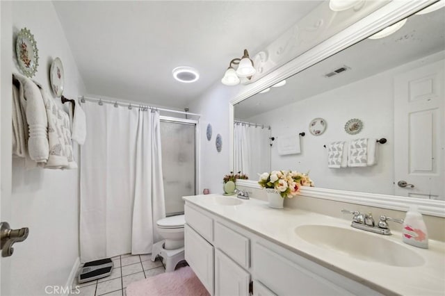 bathroom with a shower with curtain, visible vents, tile patterned flooring, and a sink