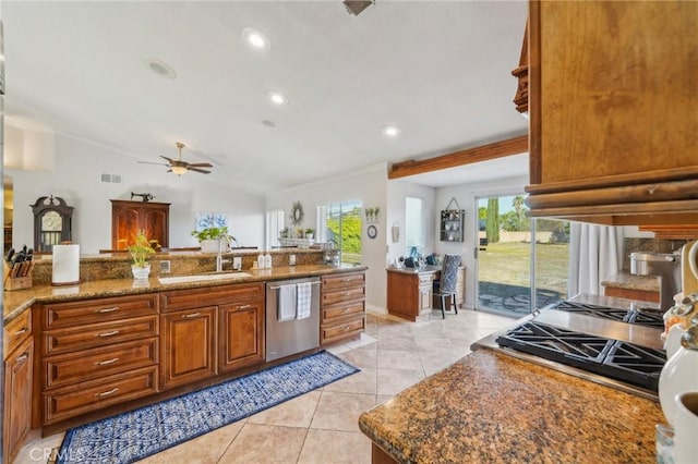 kitchen featuring a sink, a ceiling fan, brown cabinets, dishwasher, and light tile patterned floors