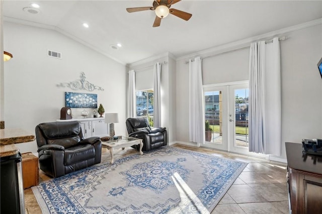 living area with ceiling fan, vaulted ceiling, crown molding, and visible vents