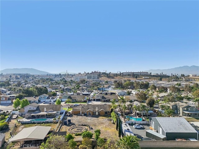 bird's eye view with a residential view and a mountain view