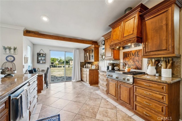 kitchen with light tile patterned flooring, brown cabinets, appliances with stainless steel finishes, and tasteful backsplash