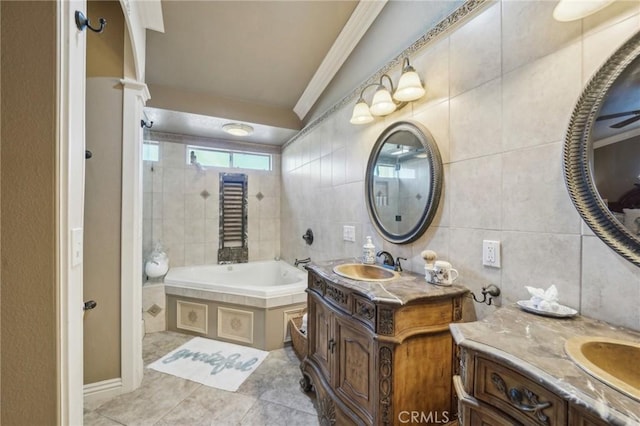 full bathroom with a bath, a sink, two vanities, and crown molding