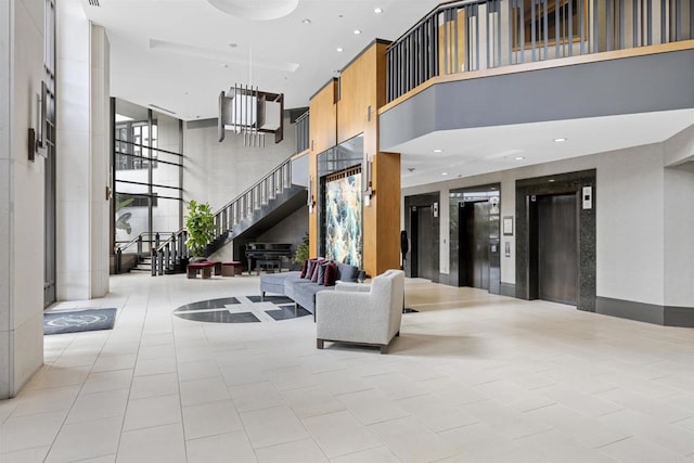 700 W Harbor Dr Unit 402, San Diego, CA 92101 - building lobby with a towering ceiling, stairway, and recessed lighting