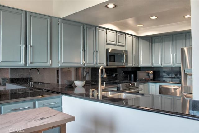 1007 S Catalina Ave Unit 212, Redondo Beach, CA 90277 - kitchen featuring stainless steel appliances, recessed lighting, backsplash, a sink, and a raised ceiling