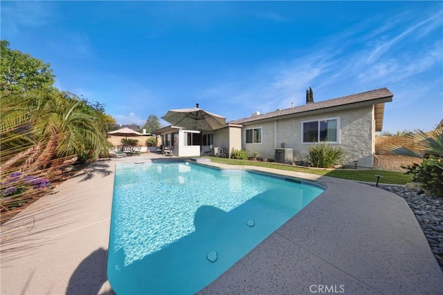 pool featuring a patio and cooling unit