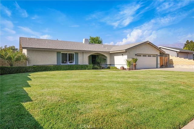 ranch-style house featuring fence, a front lawn, a garage, stucco siding, and driveway