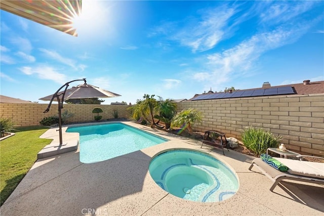 view of pool featuring a fenced in pool, an in ground hot tub, a patio area, and a fenced backyard