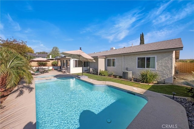 view of pool featuring central air condition unit, fence, a fenced in pool, and a patio area