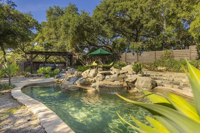 view of pool featuring a fenced backyard