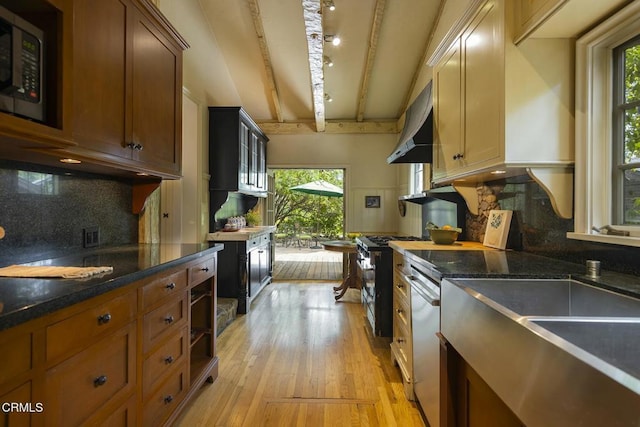kitchen with range hood, backsplash, stainless steel dishwasher, beam ceiling, and light wood-style flooring