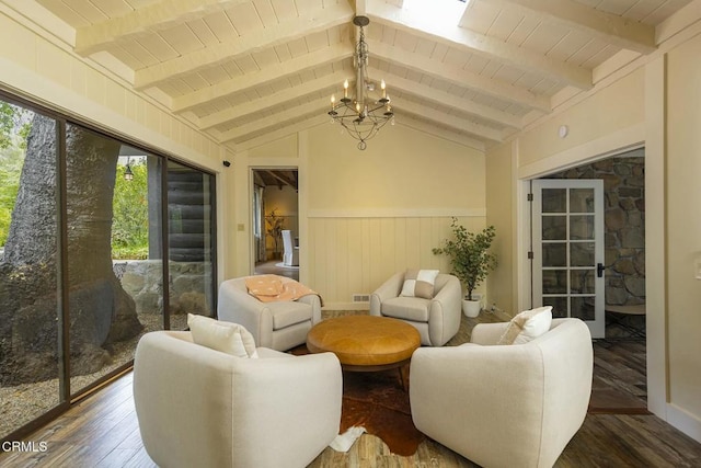 sunroom / solarium with a wealth of natural light, beamed ceiling, and an inviting chandelier
