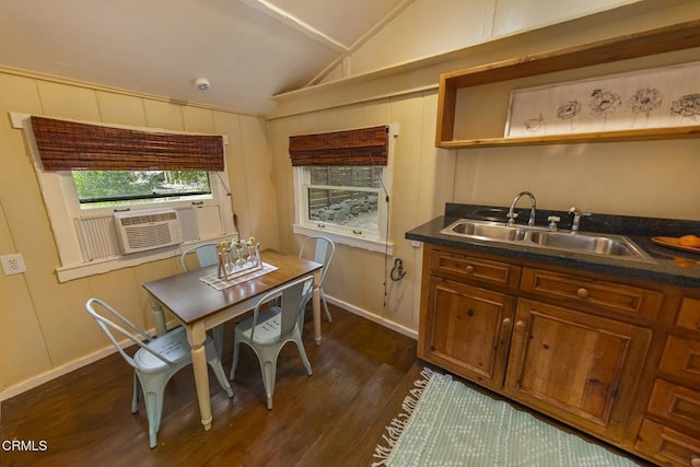 interior space with dark countertops, open shelves, a sink, lofted ceiling, and dark wood-style flooring