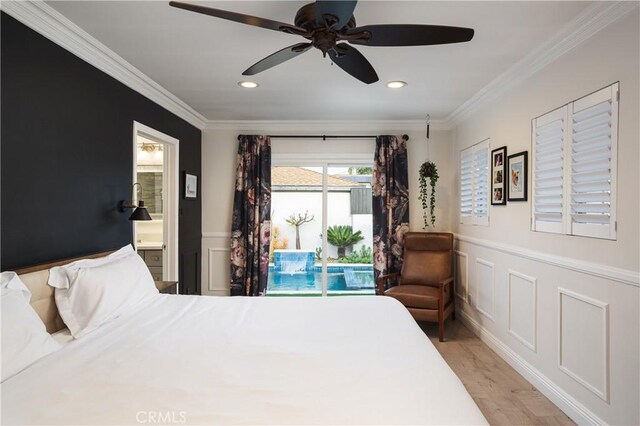 bedroom featuring a decorative wall, ornamental molding, and access to outside