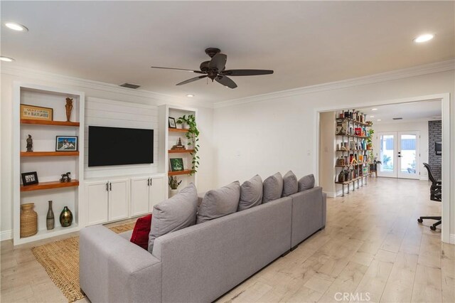 living area with light wood-style floors, ceiling fan, french doors, ornamental molding, and recessed lighting