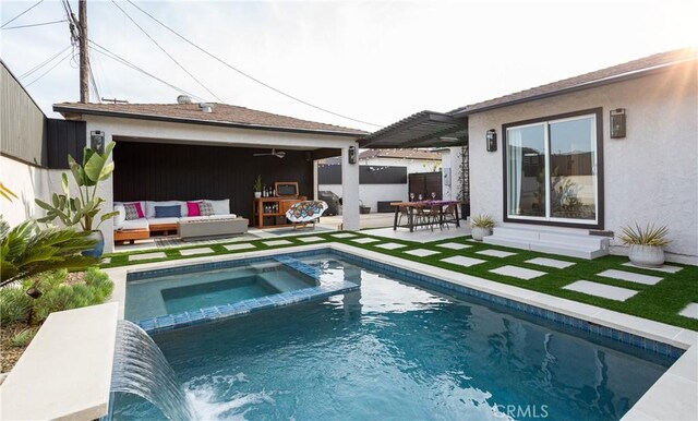 back of property featuring stucco siding, outdoor lounge area, a patio area, and a pool with connected hot tub