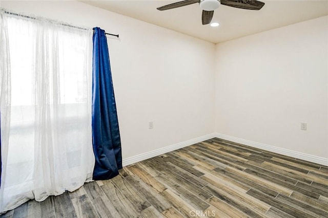 2119 Via Puerta Unit U, Laguna Woods, CA 92637 - spare room featuring baseboards, a ceiling fan, wood finished floors, and recessed lighting