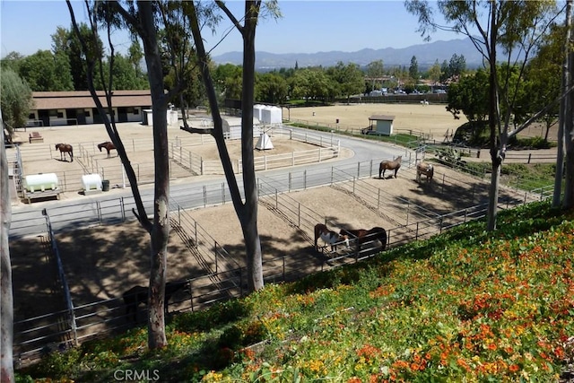 2119 Via Puerta Unit U, Laguna Woods, CA 92637 - view of property's community featuring an enclosed area, fence, and a mountain view