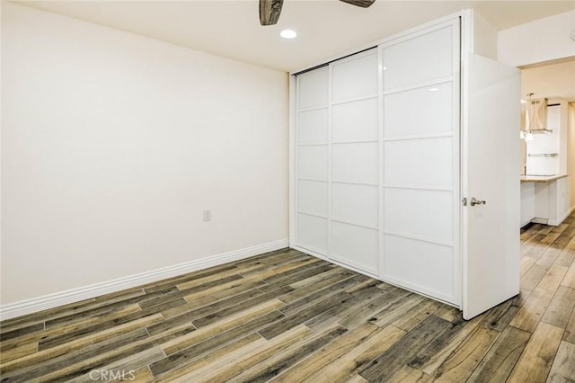 2119 Via Puerta Unit U, Laguna Woods, CA 92637 - unfurnished room featuring baseboards, wood finished floors, recessed lighting, and ceiling fan