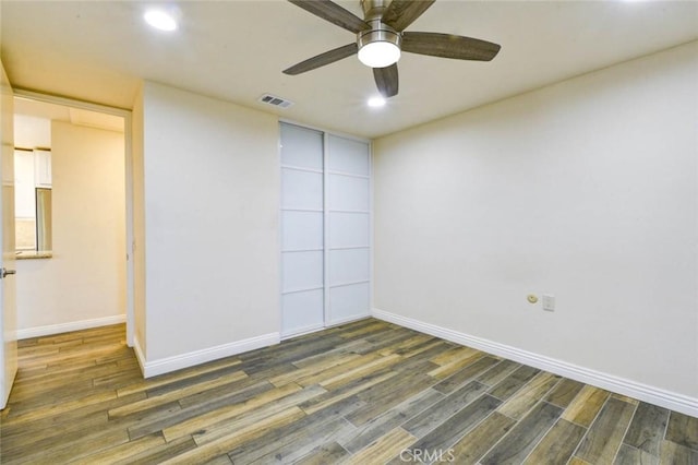 2119 Via Puerta Unit U, Laguna Woods, CA 92637 - spare room with baseboards, wood finished floors, visible vents, and recessed lighting